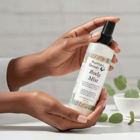 Black woman holding body mist perfume